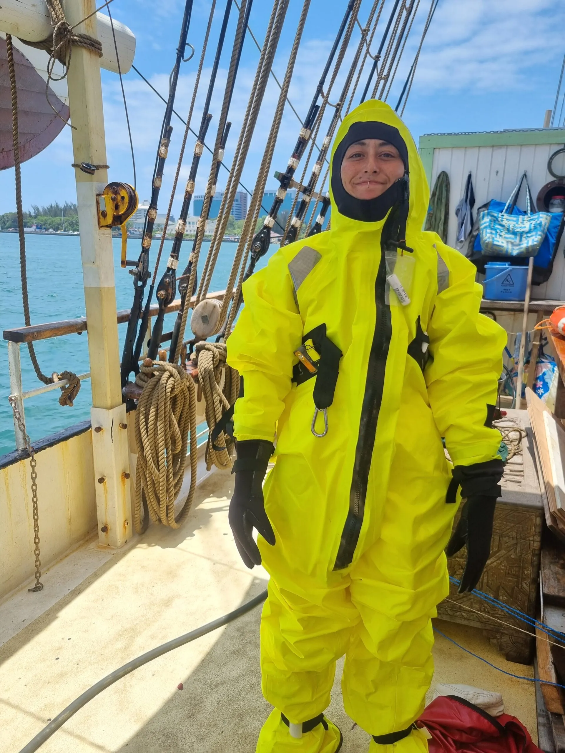 Crew snorkeling on a tropical reef and approaching NEPTUN by skiff in the Philippines
