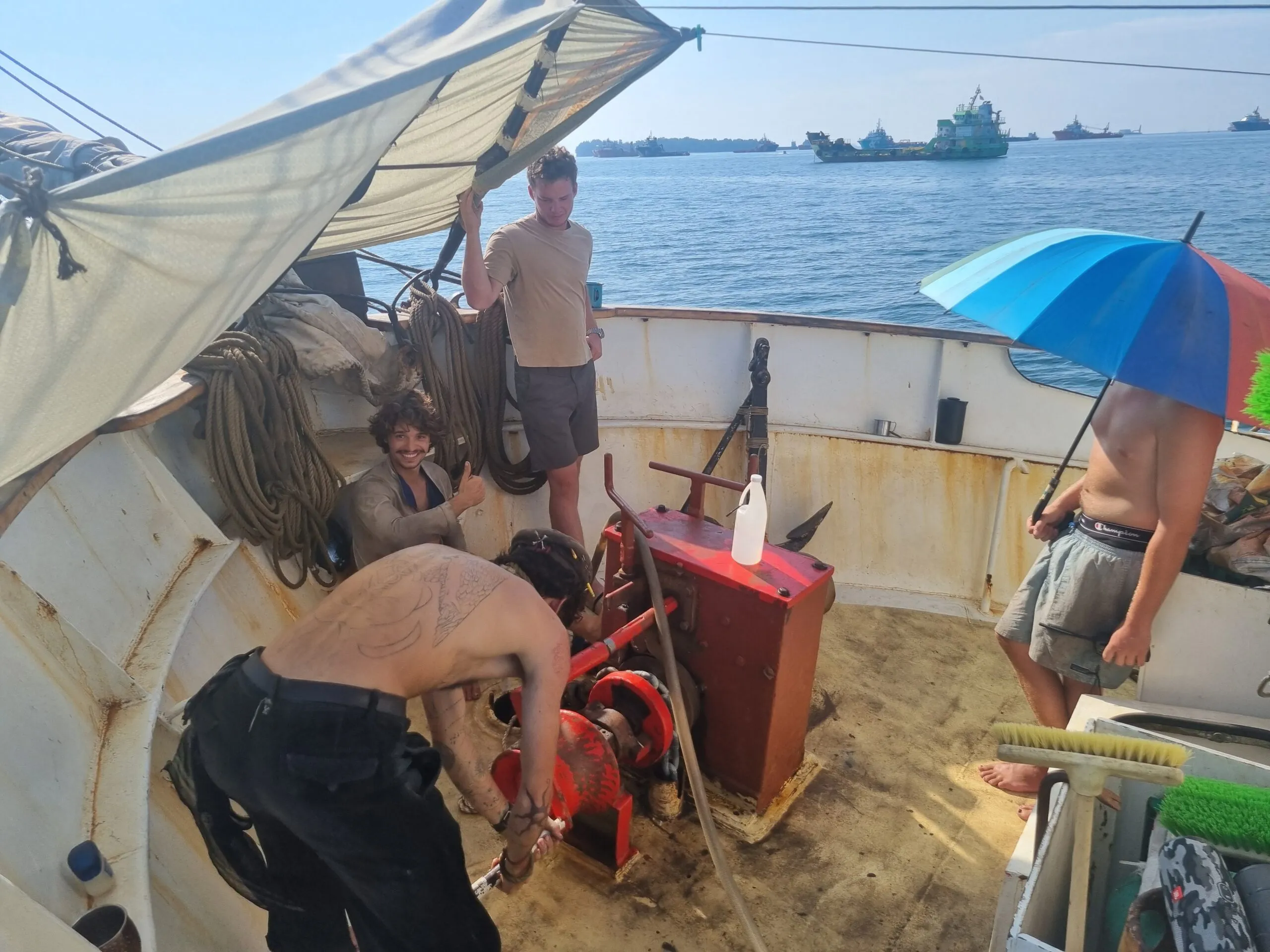 NEPTUN's crew working together on deck through the heat and challenges of the Philippine voyage