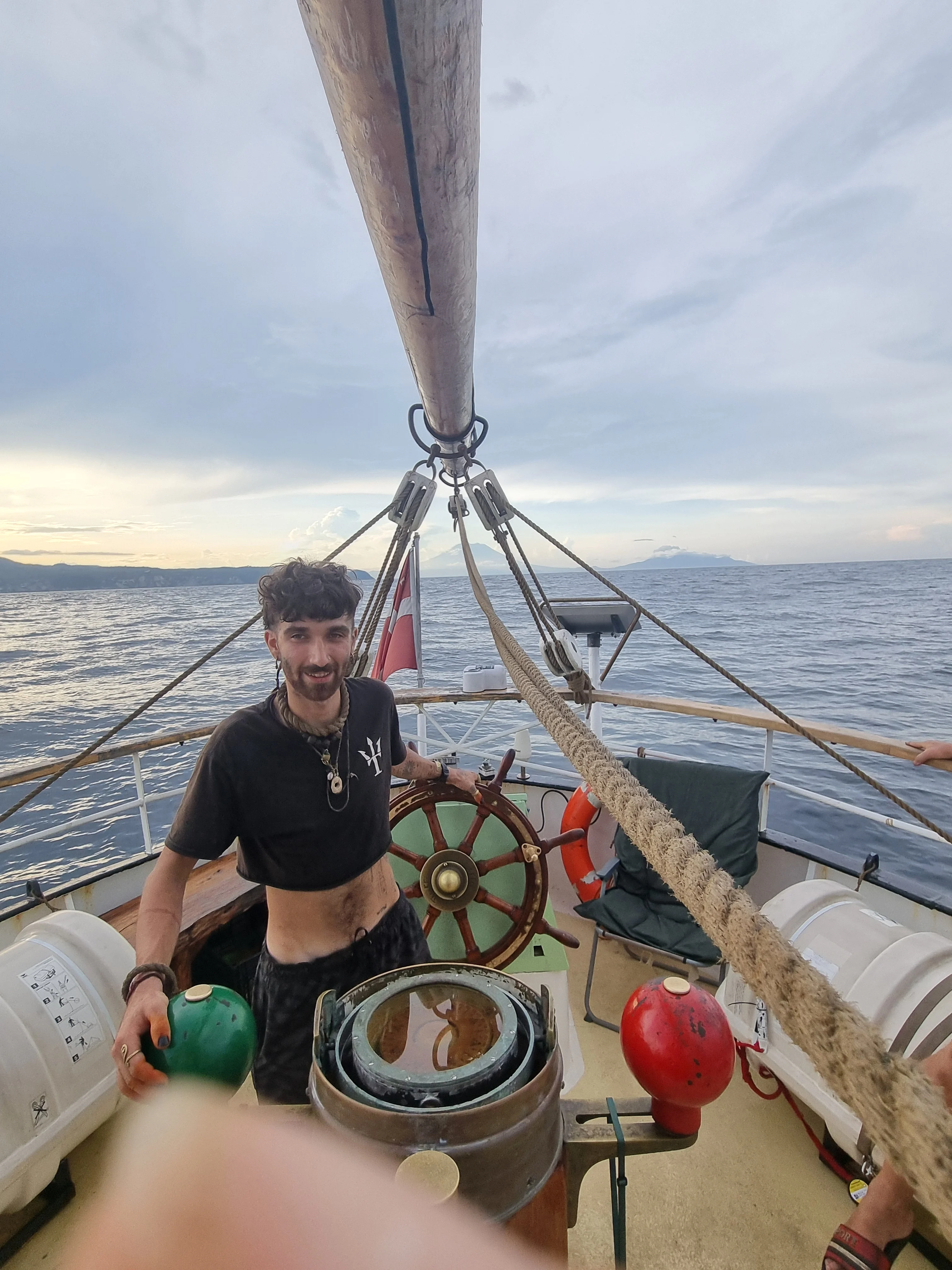 Crew at the helm of Brigantine NEPTUN under way