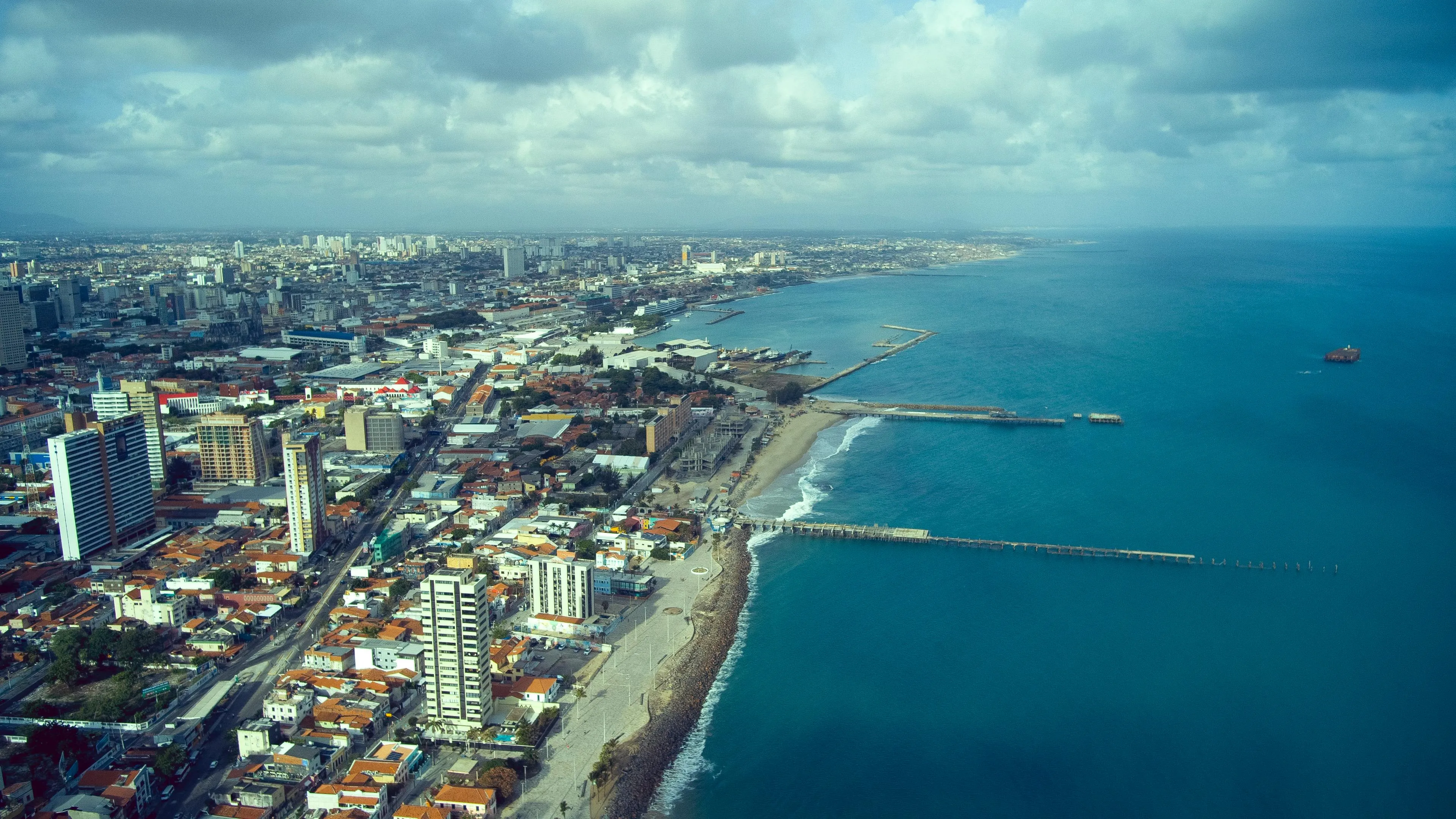 Fortaleza's long urban shoreline from above, the city pressed up against the Atlantic at the end of 3,739 nautical miles.