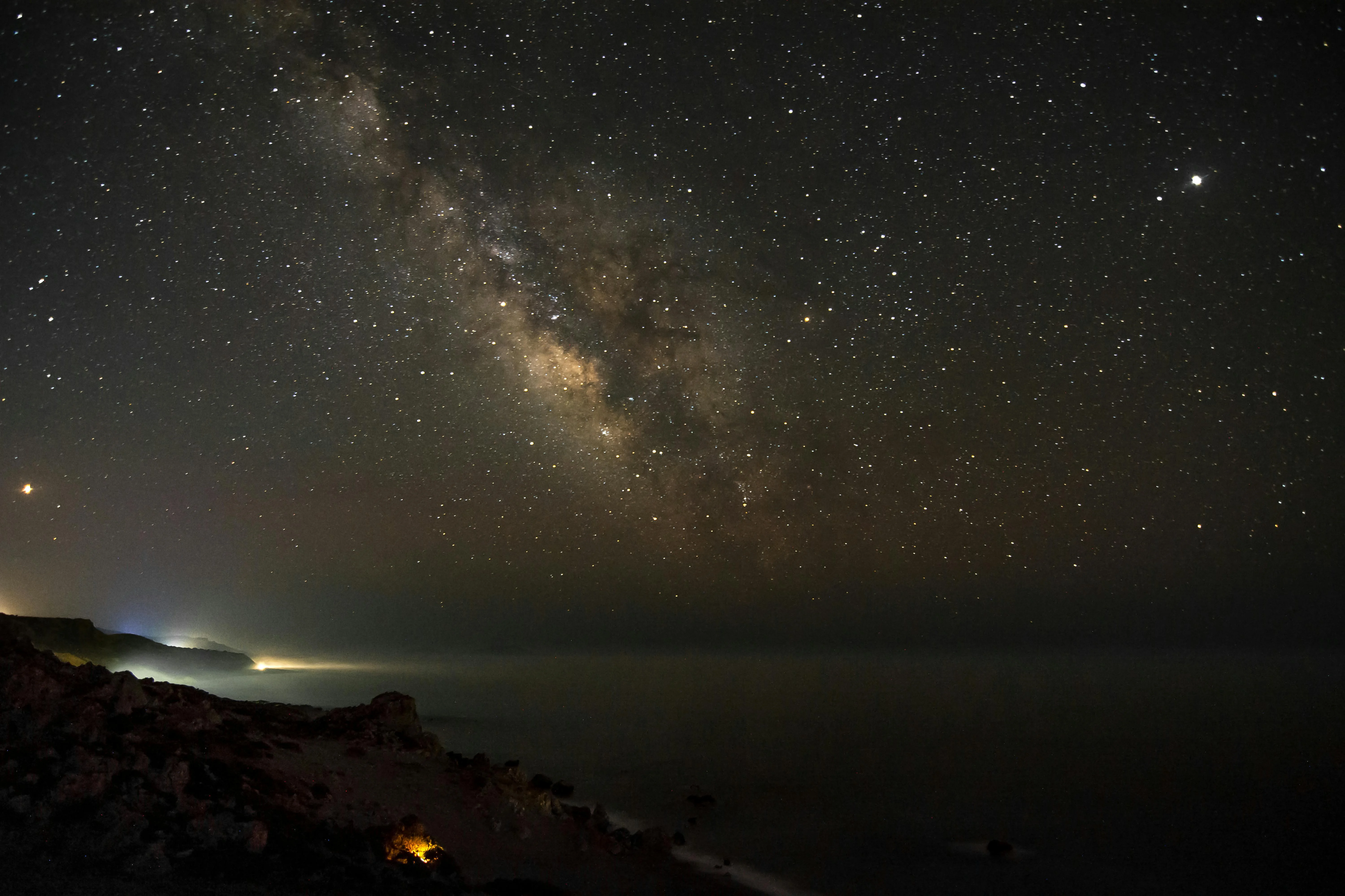 The Milky Way over a quiet ocean, the view from the midnight watch as the ship walks north toward the equator.