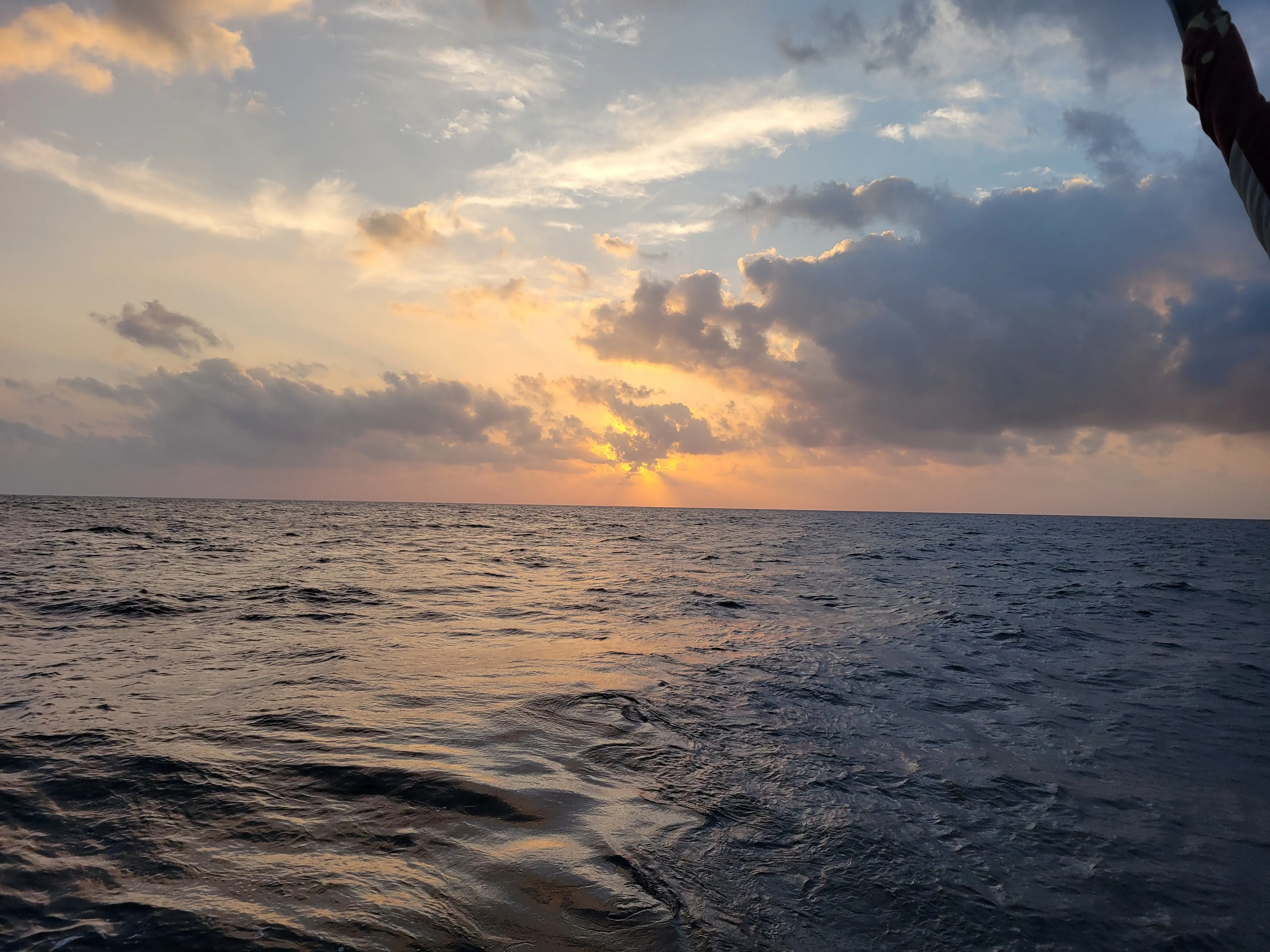 Open ocean sunset from the deck of Brigantine NEPTUN
