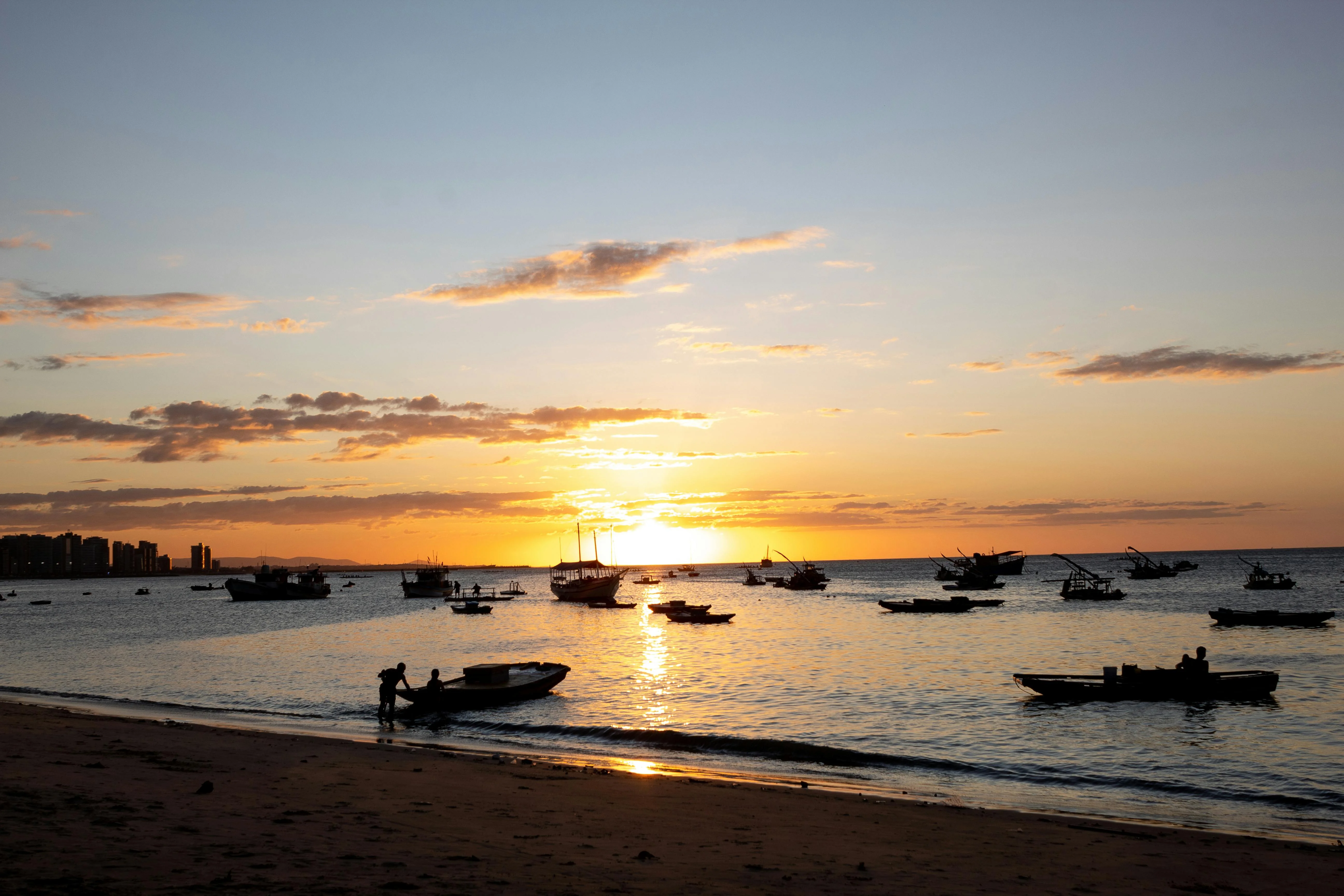 Jangada fishing boats at sunset off the Ceará coast, Brazil's northeast welcomes the ship home from sea.